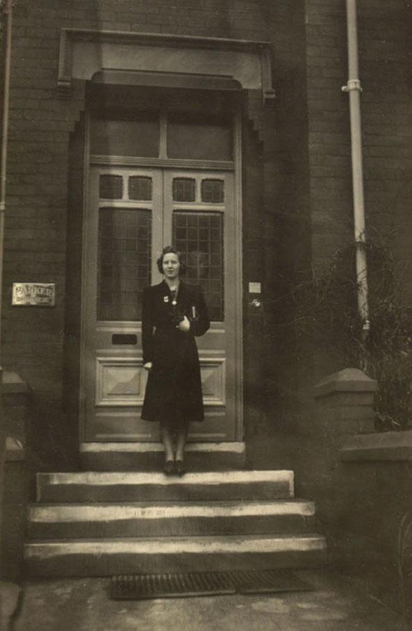1941 Joyce Hampson outside what is possibly the Miss Bishop nurse training school