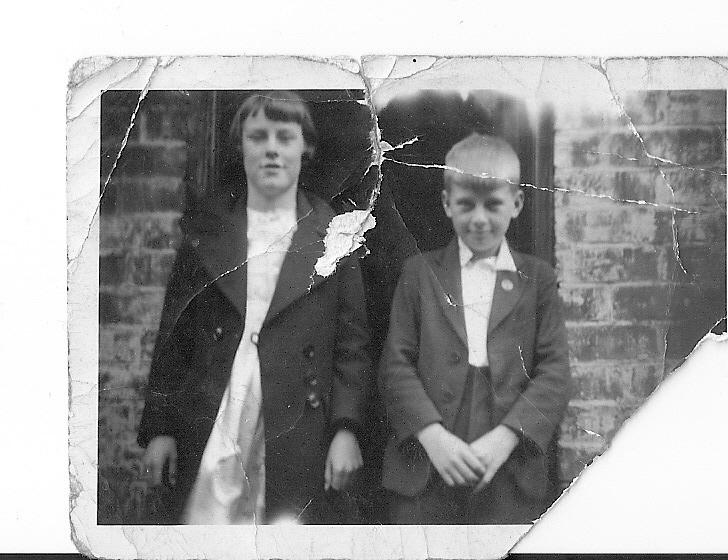 Mum and Harry outside rear of Golborne St Scholes 1936