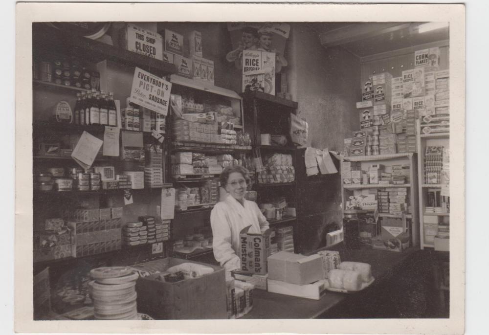 My grandma working at Morton's Shop, Hindley. 1950s
