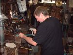 John Haslam cutting some rivets for the new footplate for Fred's traction engine (87K)