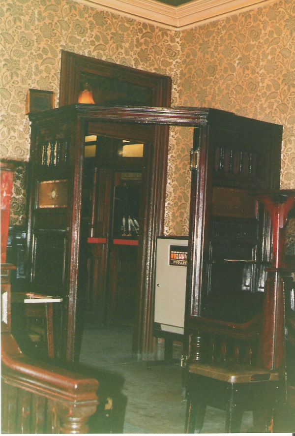 Cigarette machine in entrance to back lounge
