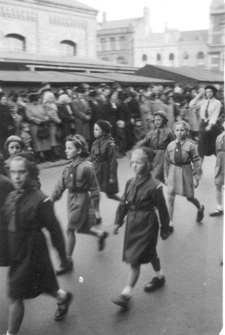 Walking past Wigan Market Hall, c1950.