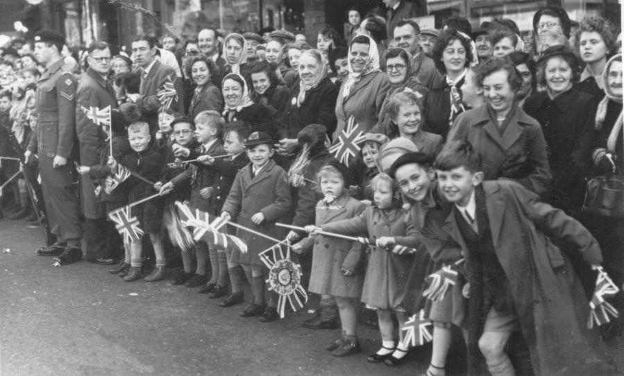 St. Mary's schoolchildren in Standishgate on the day of the Queen's visit, 1954.