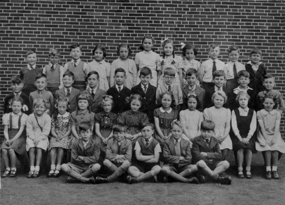 Class photo taken outside Methodist Church, which was opposite Methodist School on Dicconson Street