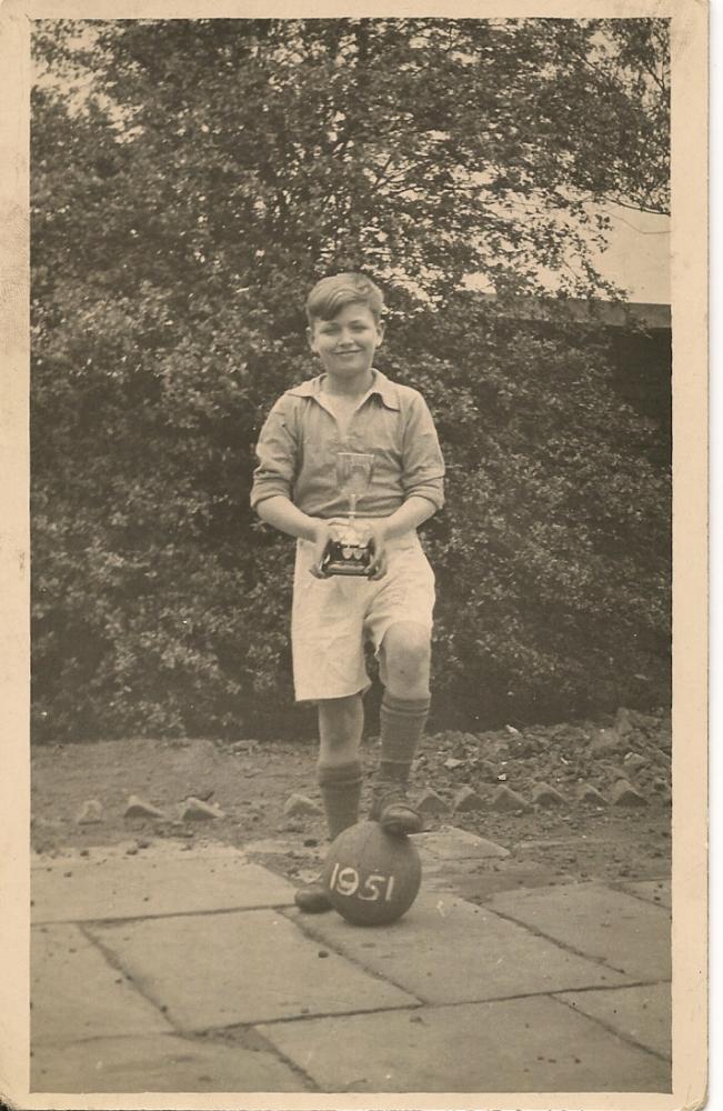 St. Nats 1951 football team-me holding the cup the team won St. Nats 1951 football team-me holding the cup the team won
