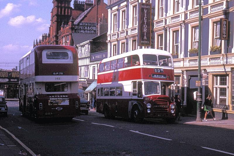 Two Corporation buses. Two Corporation buses.