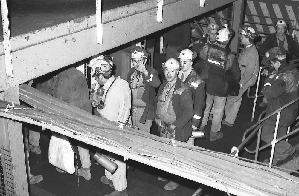 Men boarding the cage.