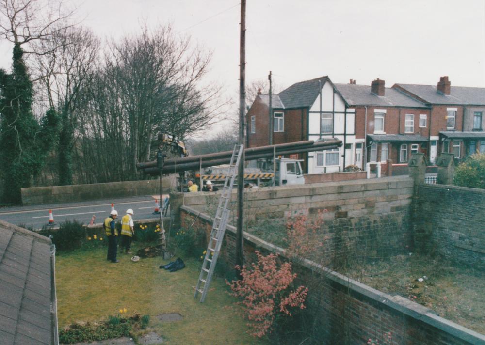 BT workers putting up a new pole