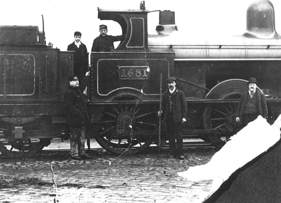 Driver Israel Hewitt (born 1846) on footplate of LNWR engine.