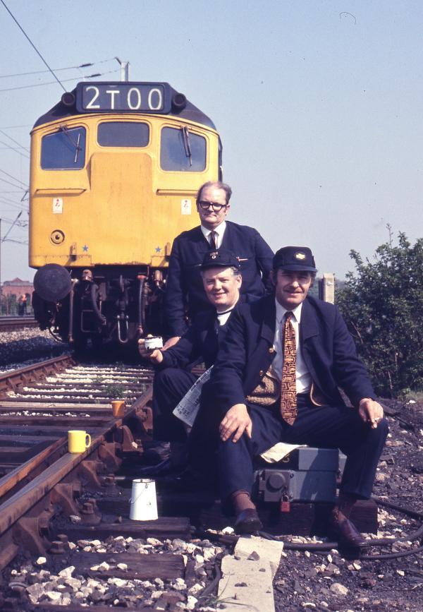 Springs Branch train crew, guard Alf Jones (standing), driver Frank Bache and his mate Jack Birchmore, 1974.