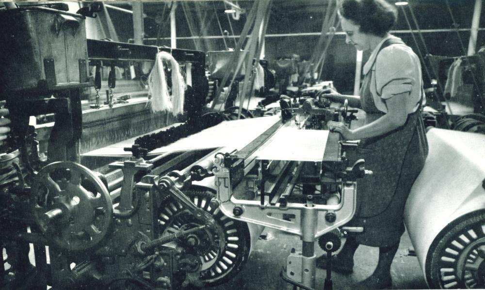 A new warp being tied up at the loom. A new warp being tied up at the loom.