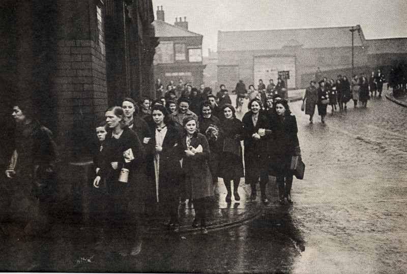 Mill girls arrive for work at Eckersley's Mills. Mill girls arrive for work at Eckersley's Mills.