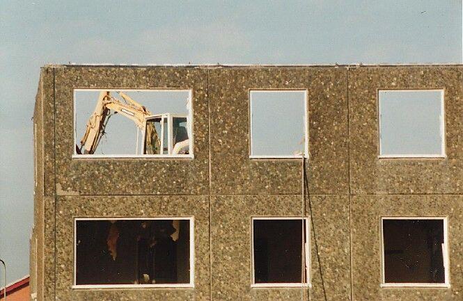 You can see the machine punching through the floor, and debris falling in the room below.