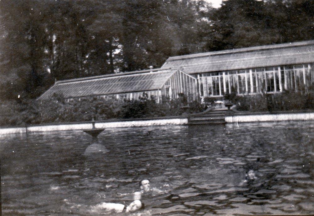 Gardening staff swimming in the lily pond