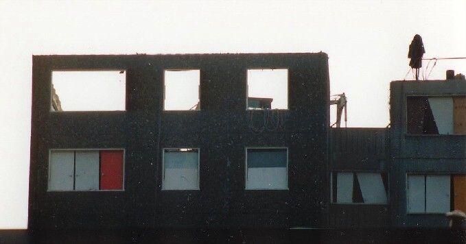 Telephoto lens shot of one of the machines at work on one of the top floors.