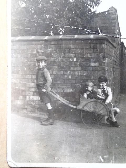 Kids with clogs and a barrow Kids with clogs and a barrow