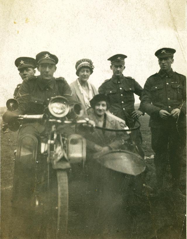 Ernest Morris riding the motor bike. Ernest Morris riding the motor bike.