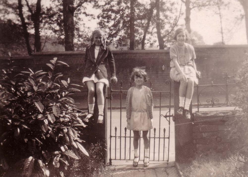 Three girls on a gate Three girls on a gate