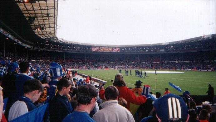 Latics fans watching the team warm up prior to the big kick off.