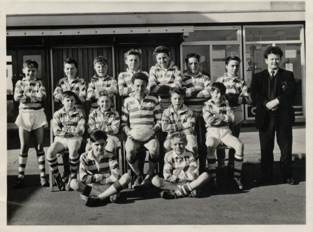 Pemberton boy's junior rugby team from 1962, i'm sat middle row holding the ball. teacher mr Brison ?
