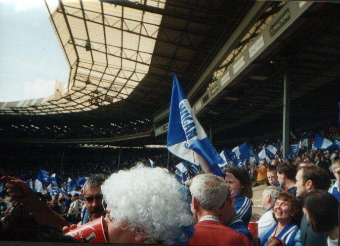 Latics fans in flag waving mood at half time.