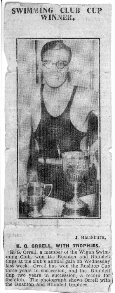 circa 1935 Ken Orrell with Wigan Swimming Club Rushton and Blundell swimming trophies. circa 1935 Ken Orrell with Wigan Swimming Club Rushton and Blundell swimming trophies.