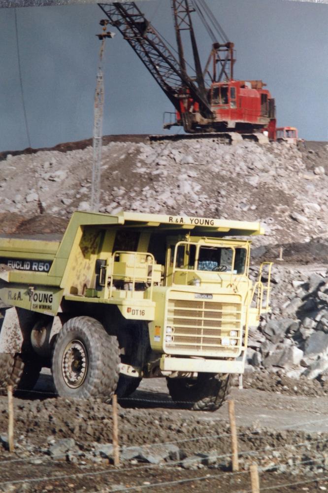Dragline and dump truck. Dragline and dump truck.