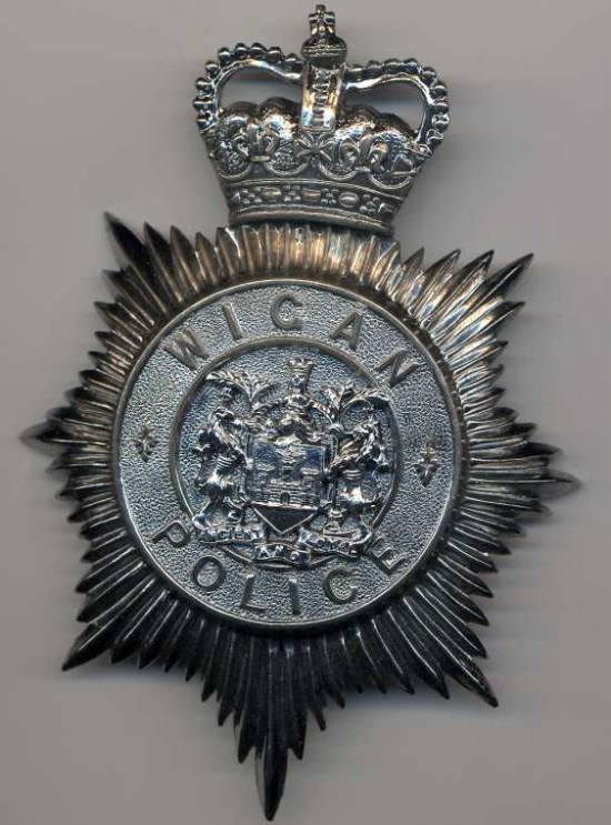 Wigan Police helmet plate. Wigan Police helmet plate.