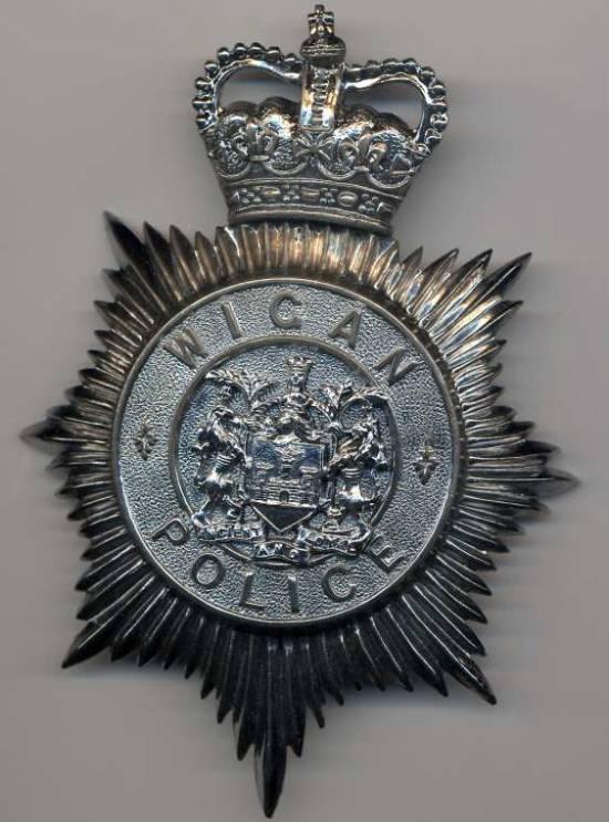 Wigan Police helmet plate.