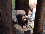 Tony Haslam stoking the main boiler's after burner (75K)