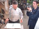 Fred talking about his visitor's book for the TV cameras (87K)