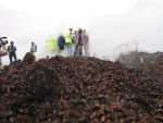 Fred, Sheila and the team amongst the rubble (69K)