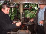 Fred and Neil Baxter rivet a boiler door for the traction engine (94K)