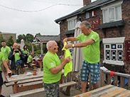 Presenting Alan with brighter shirt for never missing a single ride