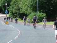 Late arrivals cycle uphill towards the Spinners