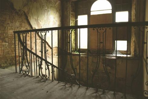 Boarded up windows on staircase