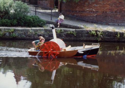 Small boat on canal at pier basin Small boat on canal at pier basin