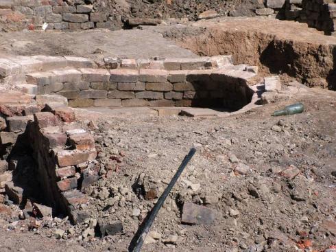 19th century baker's oven and medieval pit on right