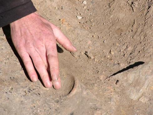 Digging Roman pottery out of the ground Digging Roman pottery out of the ground