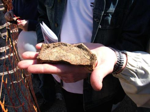 David Devine holding the Roman pottery