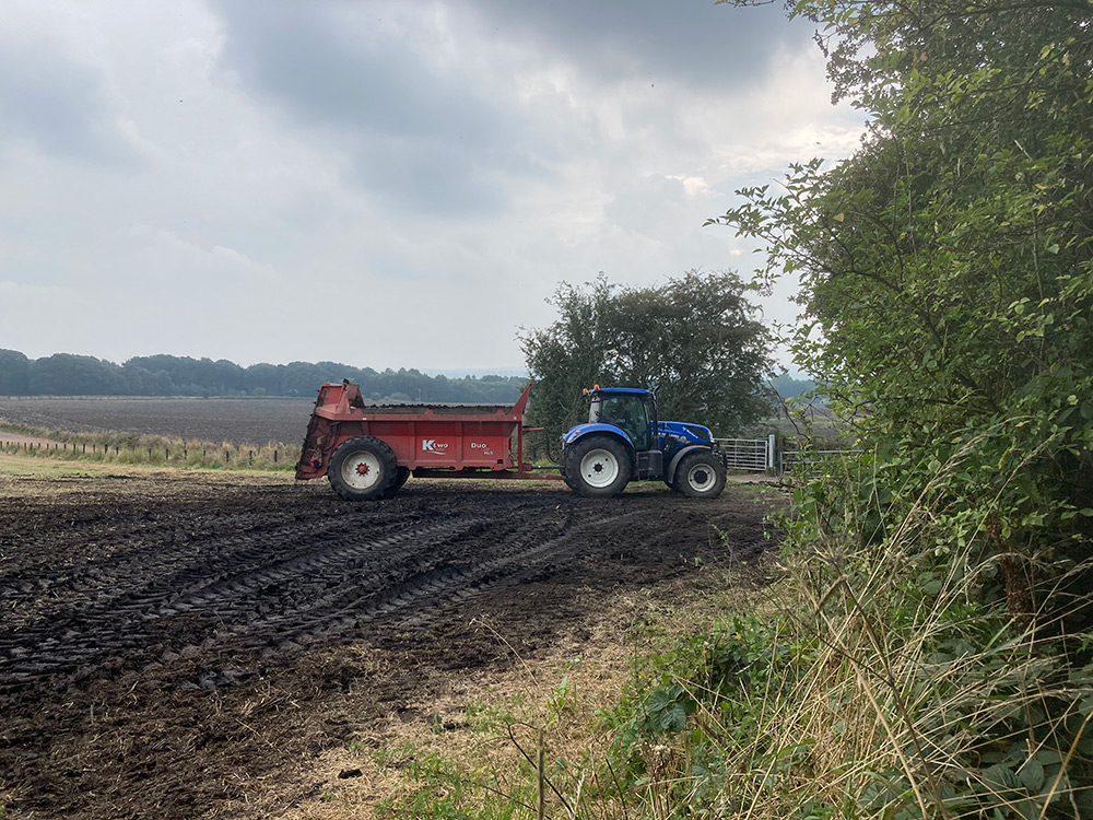 Muck Spreader on Standish Hall Farm Field